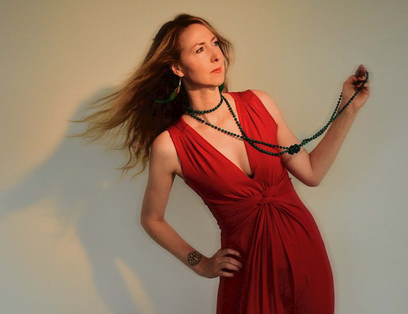 Jessie Kilguss in a red dress and black pearls