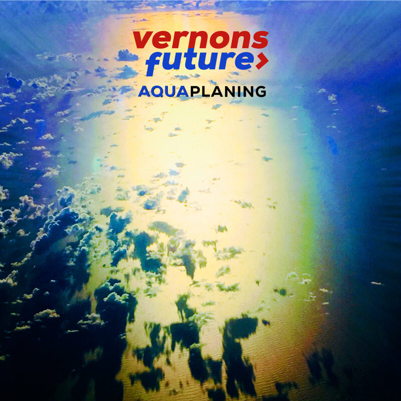 Vernon's Future Aquaplaning blue and green light in clouds reflected in water
